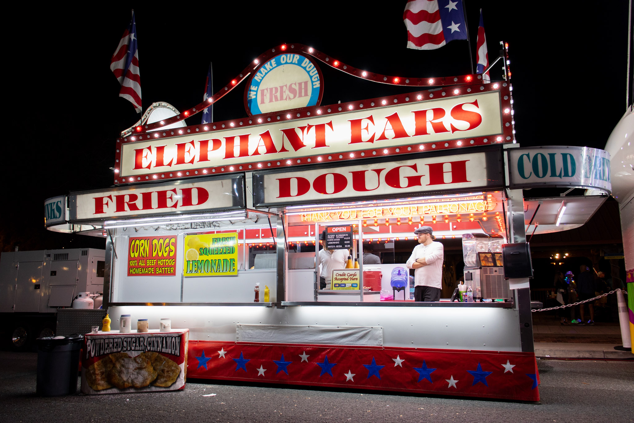 Elephant Ear Vendor Truck. It is brightly light up with red and white lights.
