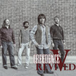 "Creedence Revived" A black and white photo of a band of 4 posing in front of a brick wall.