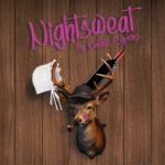 "Nightsweat by Natalie Symons" Wood panel wall with a mounted deer head. Deer is wearing a monocle and hat. A bonnet and a bottle of wine are resting in the antlers and there is a lipstick kiss on the cheek.