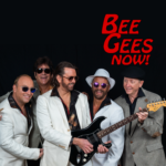 "Bee Gees Now!" A band of 5 males dressed like the the Bee Gee are posed together around a black guitar.