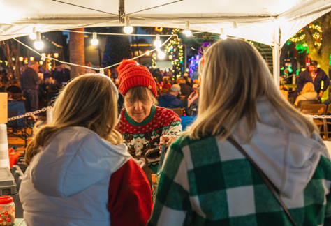 People admiring Christmas decorations