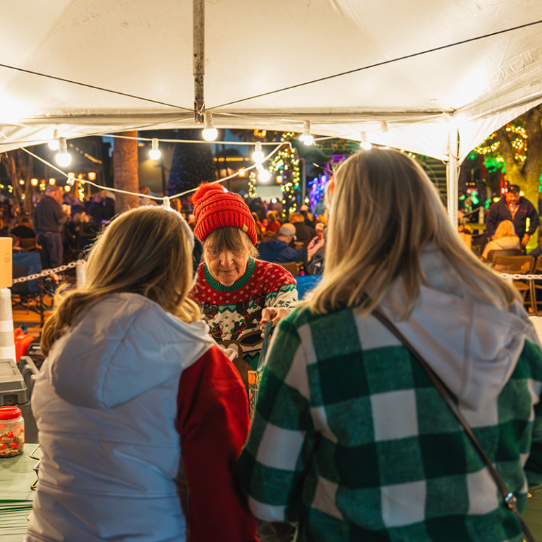 People admiring Christmas decorations