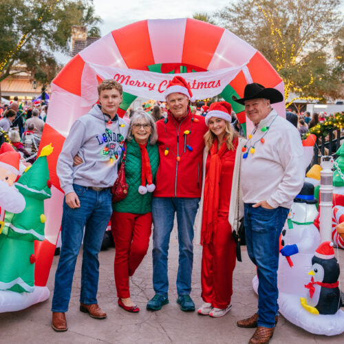 People dressed in red and white, possibly for a holiday festival.