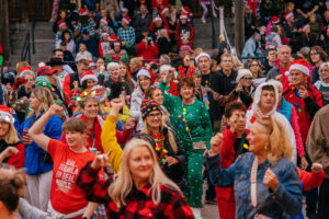 A group of people in festive attire.