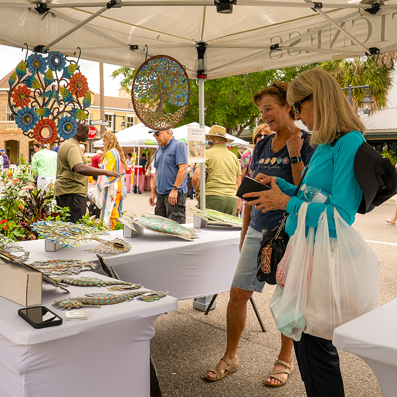 Two patrons browse home decor.