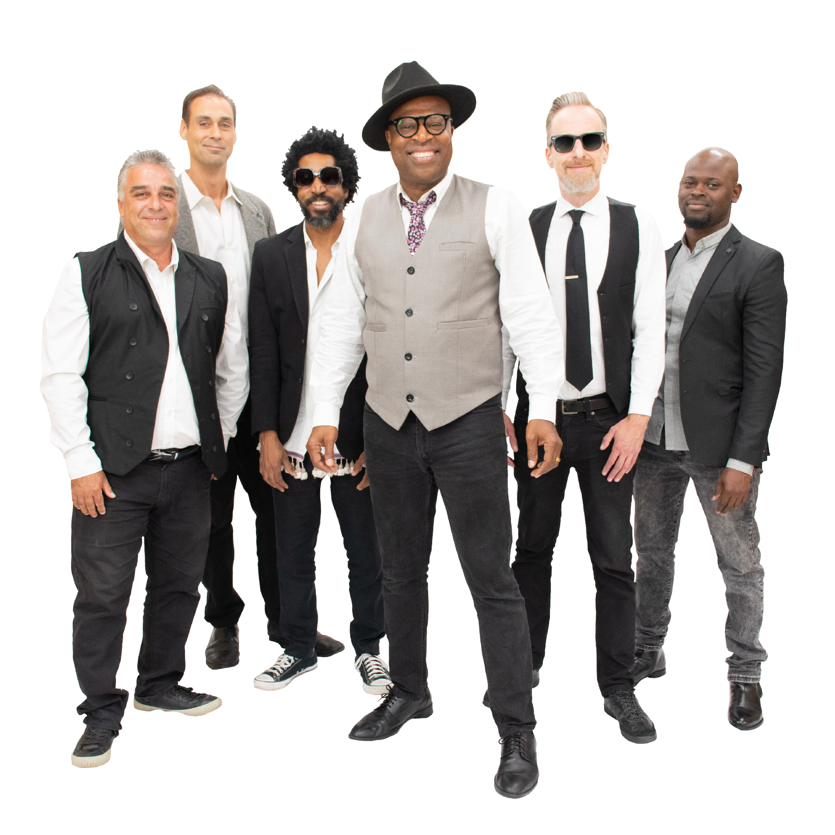 A band of six stand together, each wearing a white button up shirt with a vest or jacket and black pants. Billy stands at the center wearing a hat and floral tie.