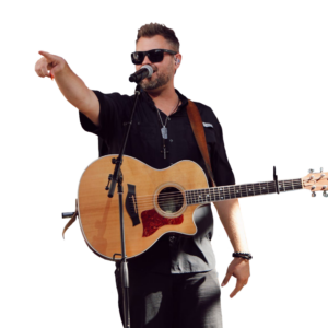 Member of The Brother's Jukebox holding a guitar and pointing to the crowd.