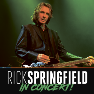 Rick Springfield performing live on stage with guitar under green lighting, with bold text below that reads “Rick Springfield In Concert.”