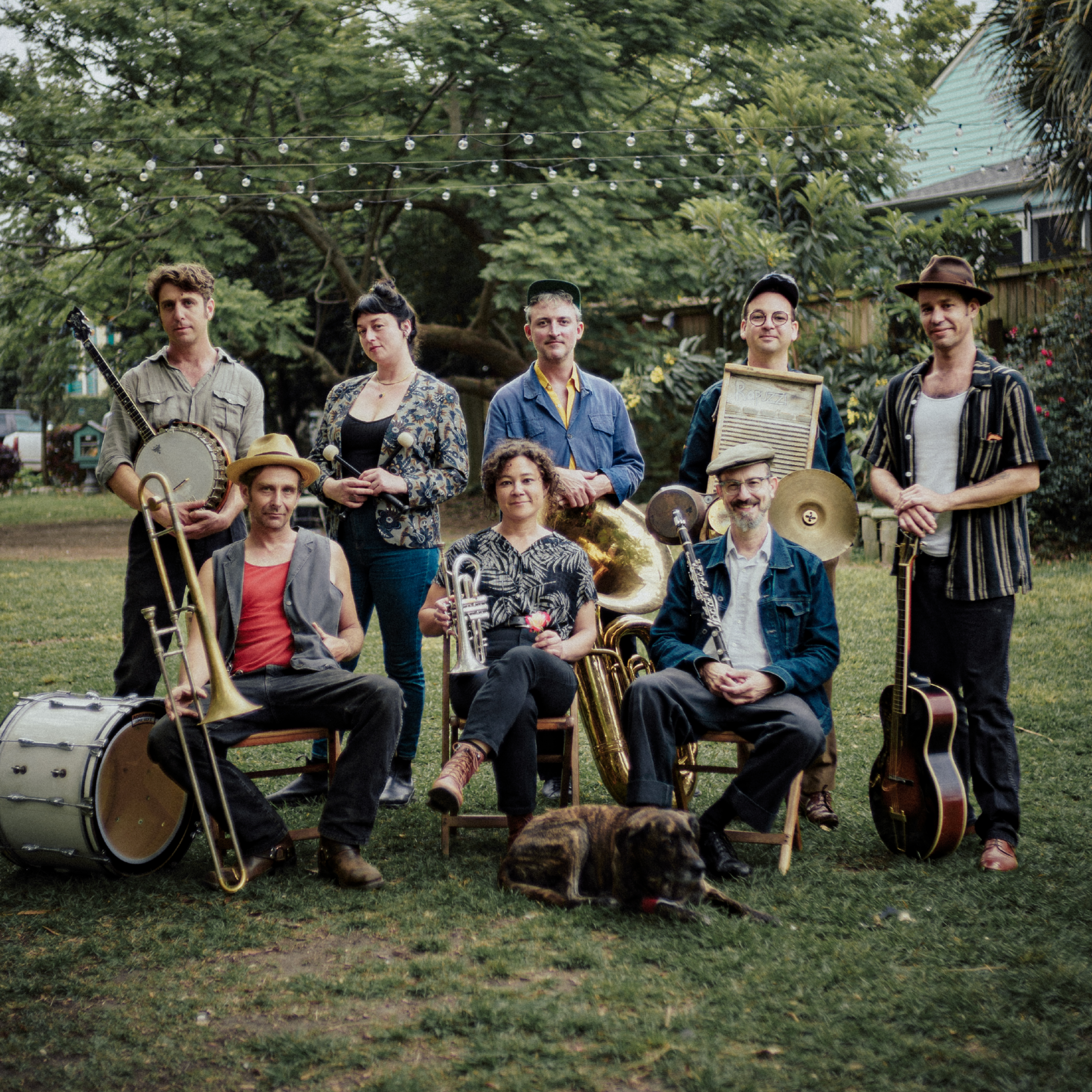 The members of Tuba Skinny posed outside with their instruments.