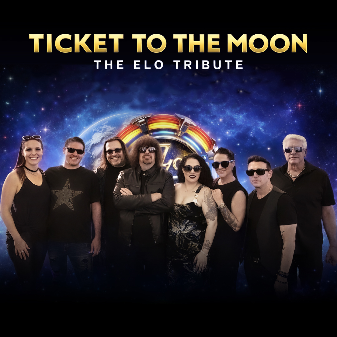 Picture of the band members wearing black clothing and sunglasses in front of a space background.