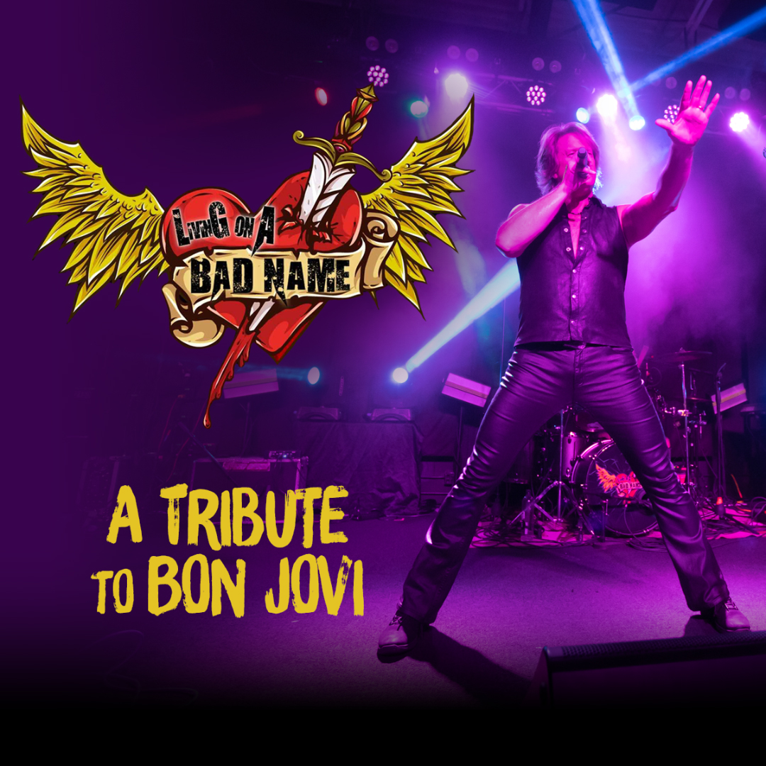 Picture of a performer on stage holding a microphone, covered in purple lighting. A heart with wings and a sword through it is on the left of the image. Livin' On A Bad Name" is written on the heart. "A Tribute To Bon Jovi" is written under the heart.