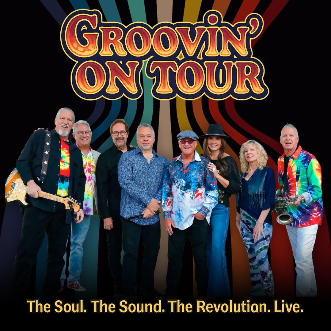 A large funk and soul band stands together across the foreground against a bold, retro‑inspired backdrop of curved, multicolored stripes radiating outward. The performers wear vibrant, patterned stage outfits in bright hues, with visible instruments including electric guitar and saxophone. At the top, large stylized lettering reads “Groovin’ On Tour.” Along the bottom, yellow text reads “The Soul. The Sound. The Revolution. Live.”