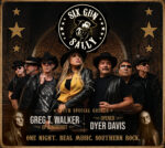 A promotional image for the band “Six Gun Sally.” At the top is a circular logo with the band name and an illustrated figure pointing forward, surrounded by stars. Below the logo, seven performers stand shoulder to shoulder wearing dark clothing and wide-brimmed hats against a textured, brick-like background. Text near the bottom reads “With special guests Greg T. Walker of Blackfoot” and “Opener Dyer Davis,” followed by the tagline “One Night. Real Music. Southern Rock.” Small portrait images appear in the lower corners.