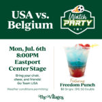 Graphic for a “USA vs. Belgium Watch Party” featuring a soccer-themed logo with a flaming soccer ball. Event details read: “Mon, Jul. 6th, 8:00PM, Eastport Center Stage. Bring your chair, cheer and friends! Go Team USA. Weather conditions permitting.” On the right is an image of a red, white, and blue layered drink in a cup labeled “The Villages.” Text below advertises “Featuring Freedom Punch – $8 Single | $10.50 Double.” The Villages logo appears at the bottom.