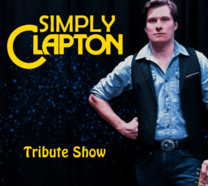 A musician stands against a dark, textured background with blue speckled lighting, wearing a denim button‑down shirt, dark vest, jeans, and a belt with a large buckle, posed with one hand resting at the waist. Bold yellow text on the left reads “SIMPLY CLAPTON,” with the word “Clapton” styled around a large curved letter “C.” Smaller yellow text near the bottom reads “Tribute Show.”
