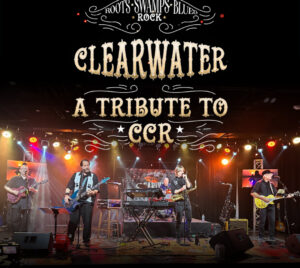 The scene shows a live band performing on a concert stage with warm amber and red stage lighting, spotlights, and visible lighting rigs overhead. Multiple musicians perform across the stage using electric guitars, bass, keyboards, and drums, with a saxophone and a microphone on stands and amplifiers arranged throughout. At the top, decorative text reads “Roots • Swamps • Blues • Rock,” followed by large distressed lettering reading “CLEARWATER” and “A Tribute to CCR.”