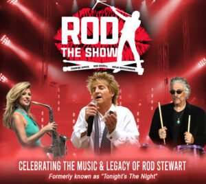 The scene is set on a red, concert‑style stage with bright spotlights and lighting rigs in the background. At the top, bold white text reads “ROD THE SHOW,” accompanied by a silhouette graphic of a singer holding a microphone stand. In the foreground, three performers are shown mid‑performance: one holding a saxophone, one singing into a handheld microphone while wearing a white shirt and tie, and one playing drums. Along the bottom, white text reads “Celebrating the Music & Legacy of Rod Stewart,” with smaller text beneath stating “Formerly known as ‘Tonight’s The Night’.”
