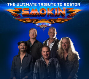 Five band members are posed together against a deep blue background, speckled to look like outer space. At the top, bold white text reads “The Ultimate Tribute to Boston” with a neon blue grid behind the letters. Below it is a large, stylized “Smokin’” logo with orange spiked shapes around the text and a UFO below. The performers wear dark, rock‑inspired clothing.