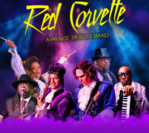 Six performers stand side by side on a stage under dramatic purple and blue lighting, wearing ornate, vintage‑inspired stage costumes and holding musical instruments including a guitar and a keyboard. Stylized yellow script text at the top reads “Red Corvette,” with smaller text below that reads “A Prince Tribute Band.” Purple fog fills the lower portion of the image, creating a theatrical concert atmosphere.