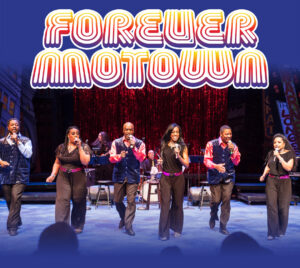 Promotional poster for Forever Motown. 6 performers are on stage holding microphones. Behind them a band is playing instruments in front of a red sparkly curtain. The top and bottom of the image has a blue fog overlaying it. The title is written over the blue fog at the top and it is written in white, yellow, orange, red, and purple bubble letters with multiple lines.