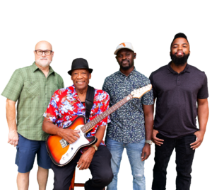 Bobby Blackmon sits on a stool, holding a guitar, with his 4 bandmates. (Background is transparent).