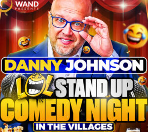 Promotional poster for Wand Presents - "LOL" July Stand Up Comedy Night. A man wearing glasses is in front of a red show curtain. The image says "Danny Johnson, "LOL" Stand Up Comedy Night in The Villages.