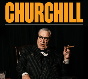 Promotional poster for CHURCHILL at The Tracy. Pictured is a man smoking a cigar against a black background. In a bright yellow/orange it reads "CHURCHILL."