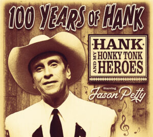Sepia-toned promotional poster with a vintage country‑music style. A person wearing a light-colored cowboy hat, collared shirt, and dark tie appears in a posed portrait against a wood-textured background. Large distressed lettering at the top reads “100 Years of Hank.” To the right, a framed sign reads “Hank and My Honky Tonk Heroes.” At the bottom, script text reads “Starring Jason Petty,” with small musical note graphics scattered across the background.
