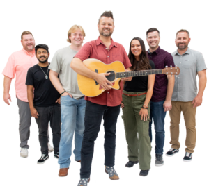 Members of The Brothers Jukebox in a v formation. The lead holds a guitar.