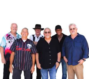 Think Big Band, a group of 6, stand together smiling.